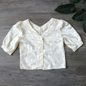Floral cream white blouse with fabric buttons down the middle and